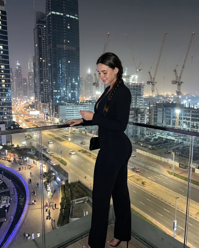 Travel: Dubai AI photoshoot sample 4 of 5: natural candid Instagram-style photo of the same woman, different outfit and pose